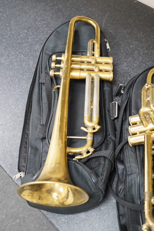 Three student trumpets by Beltone, etc. in soft cases and a cased Boosey & Hawkes trombone. Condition - poor to fair, all play